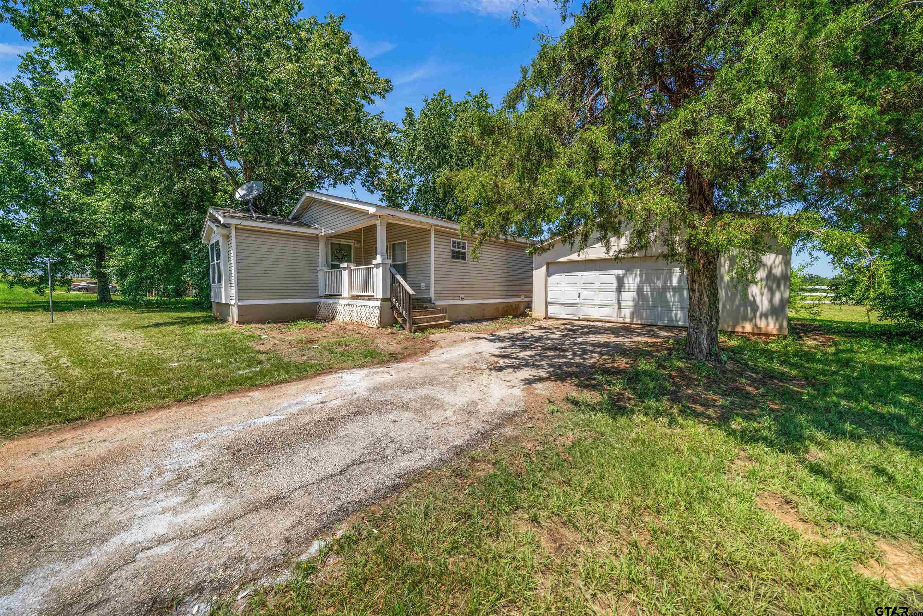 10490 Peterson Tyler, TX 75708 - Photo 2 of 30 a front view of a house with garden
