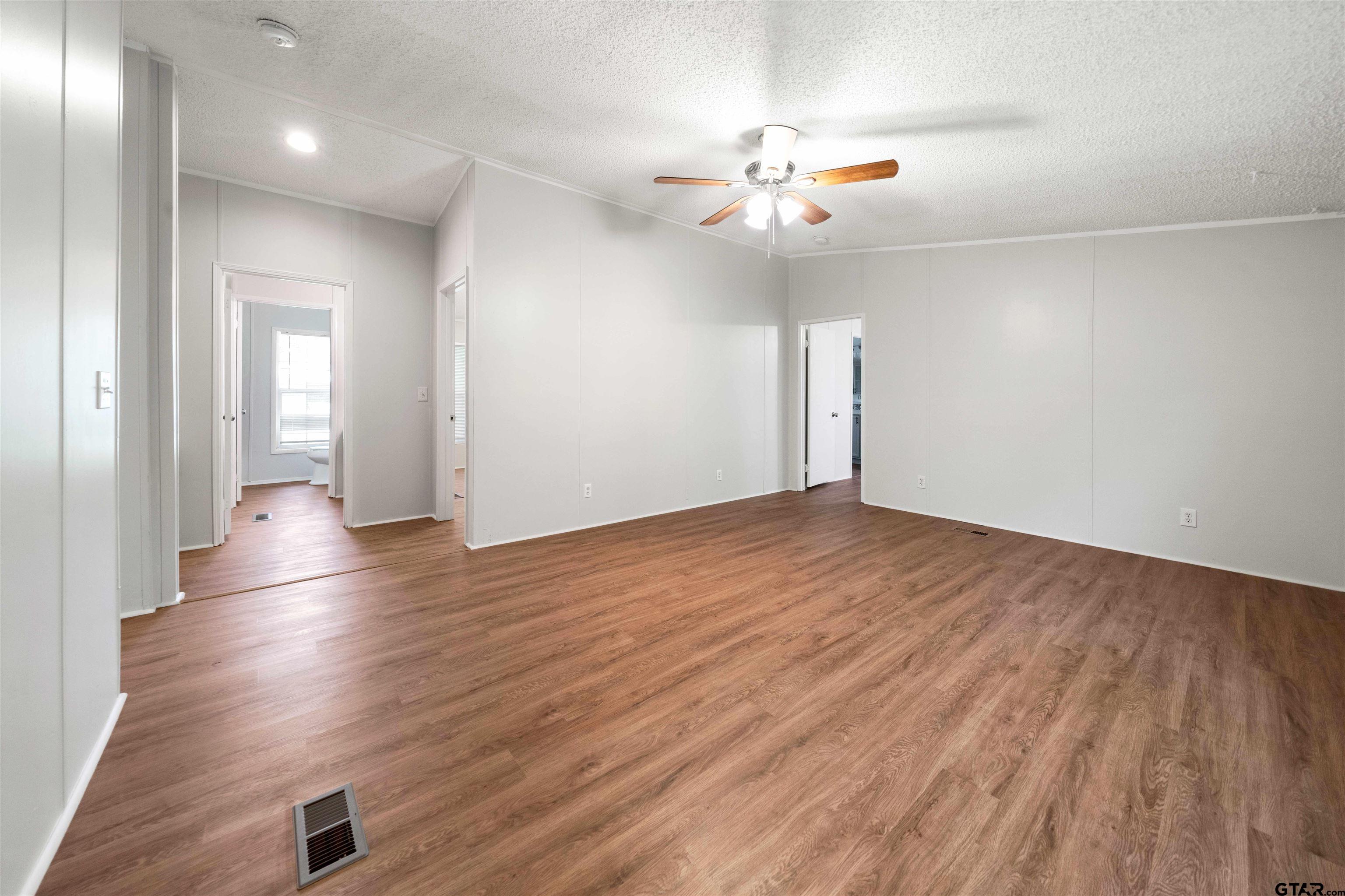 10490 Peterson Tyler, TX 75708 - Photo 21 of 30 wooden floor in an empty room with a window