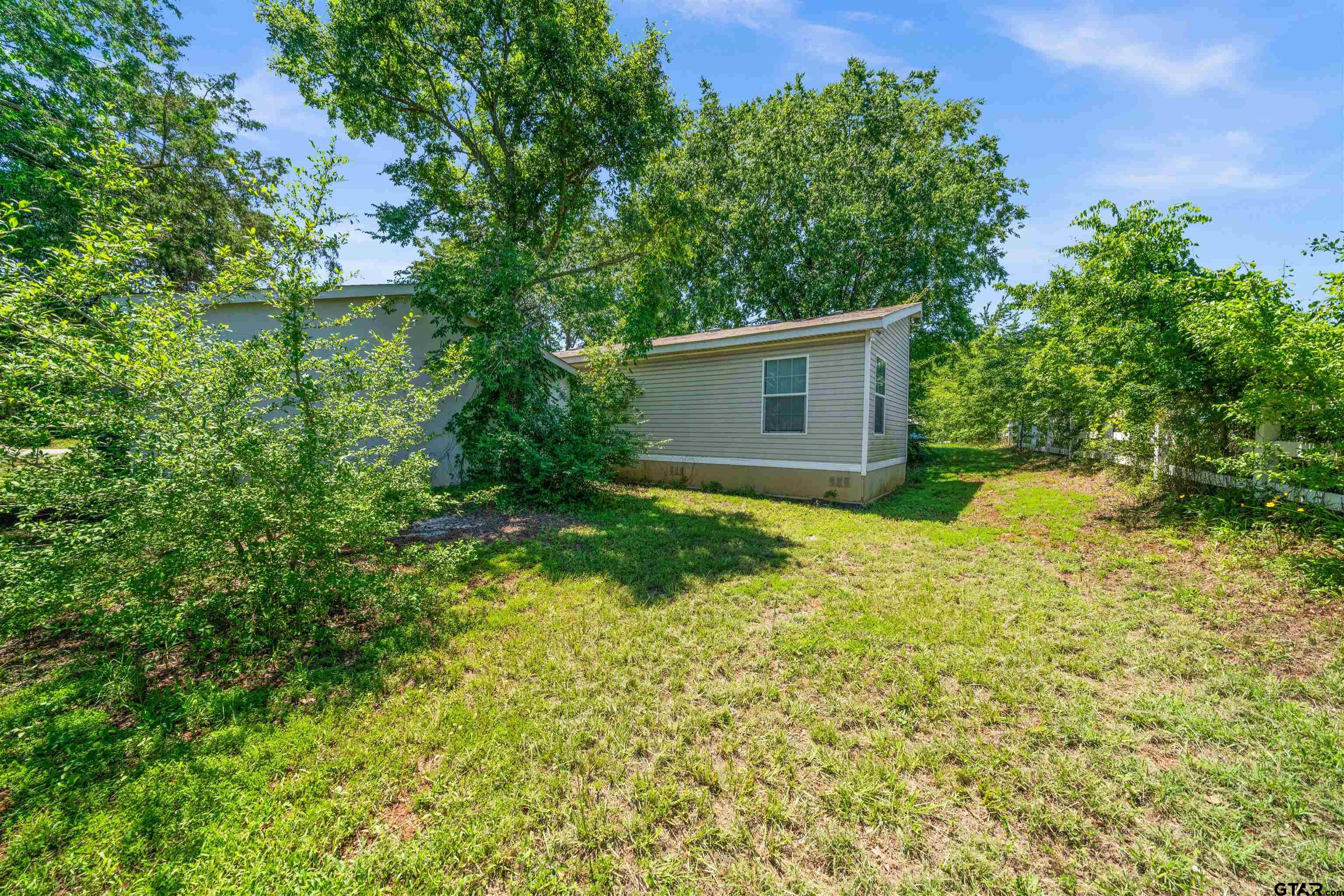 10490 Peterson Tyler, TX 75708 - Photo 30 of 30 a view of backyard of house with green space