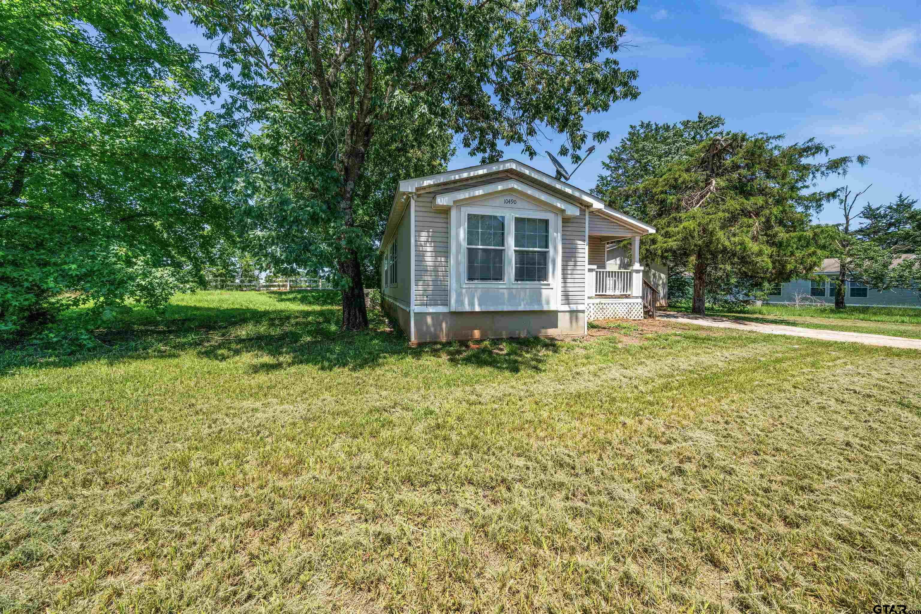 10490 Peterson Tyler, TX 75708 - Photo 3 of 30 a front view of a house with garden