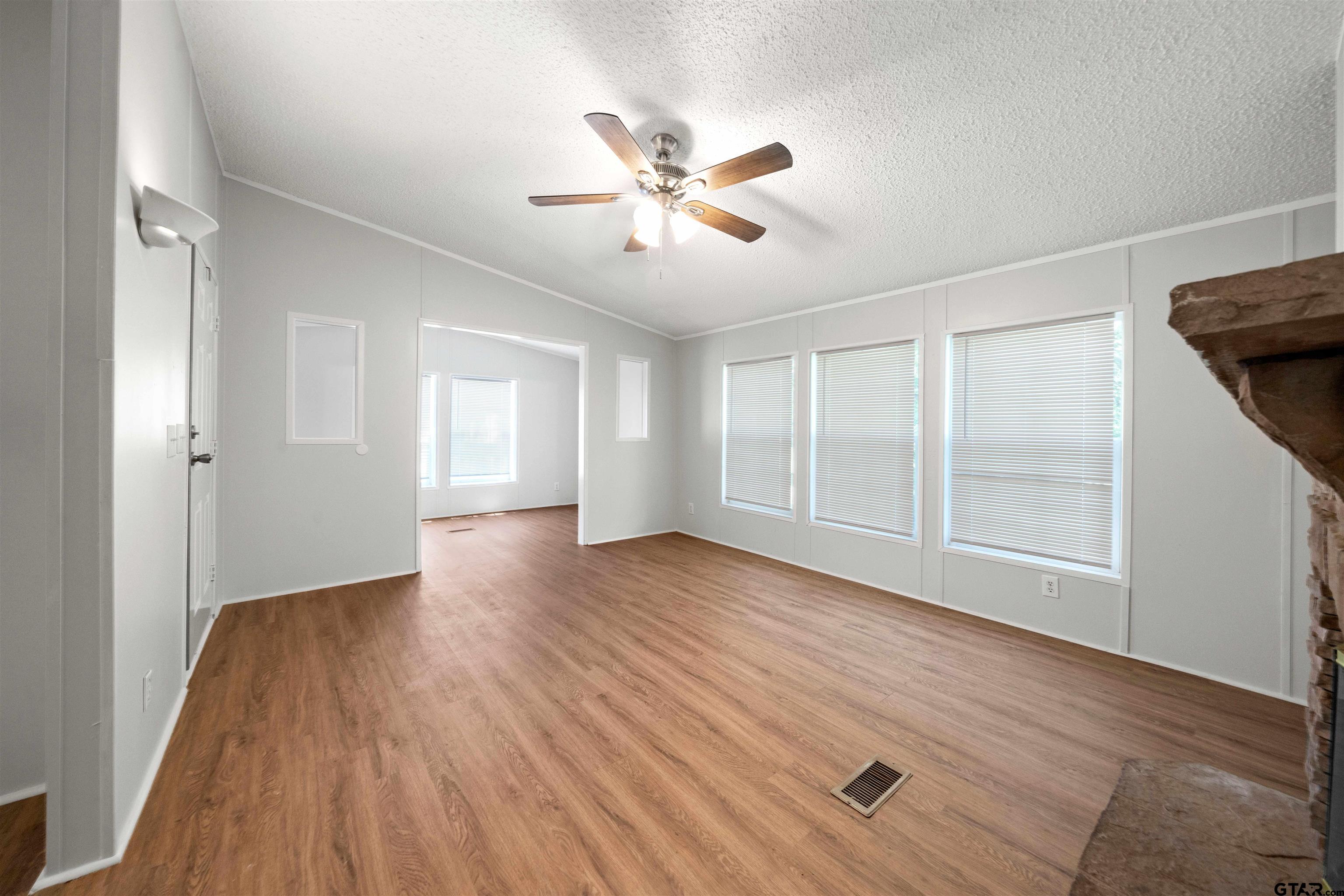 10490 Peterson Tyler, TX 75708 - Photo 6 of 30 a view of empty room with wooden floor and fan
