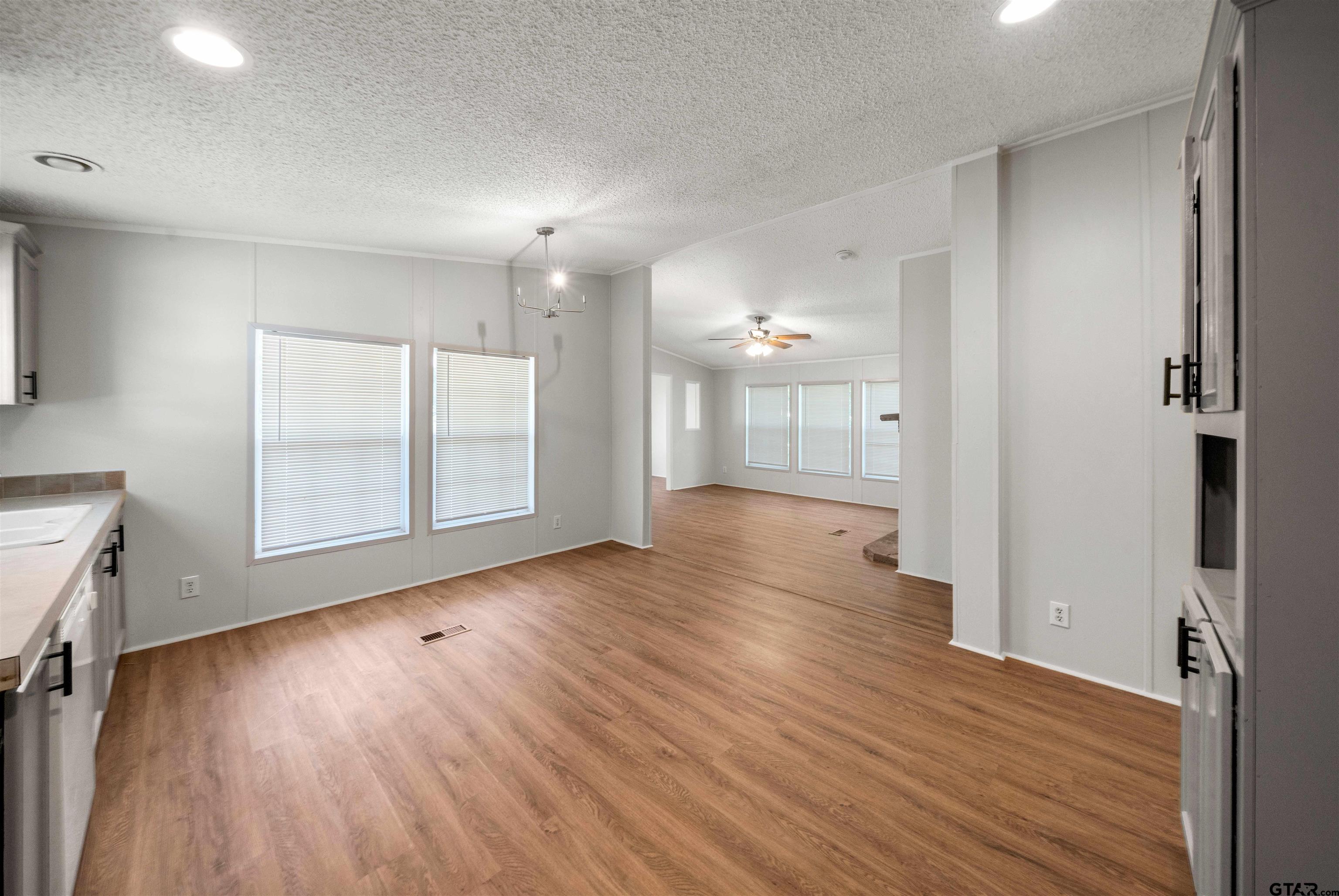 10490 Peterson Tyler, TX 75708 - Photo 8 of 30 an empty room with wooden floor and windows