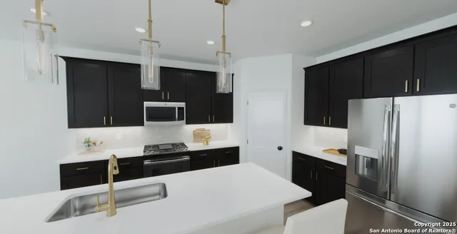 a room with a sink and cabinets