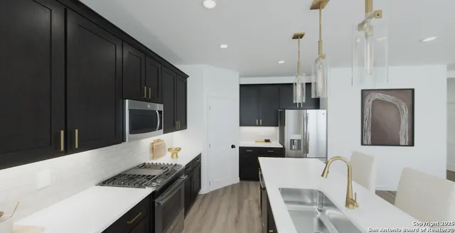 an aerial view of a residential houses with outdoor space