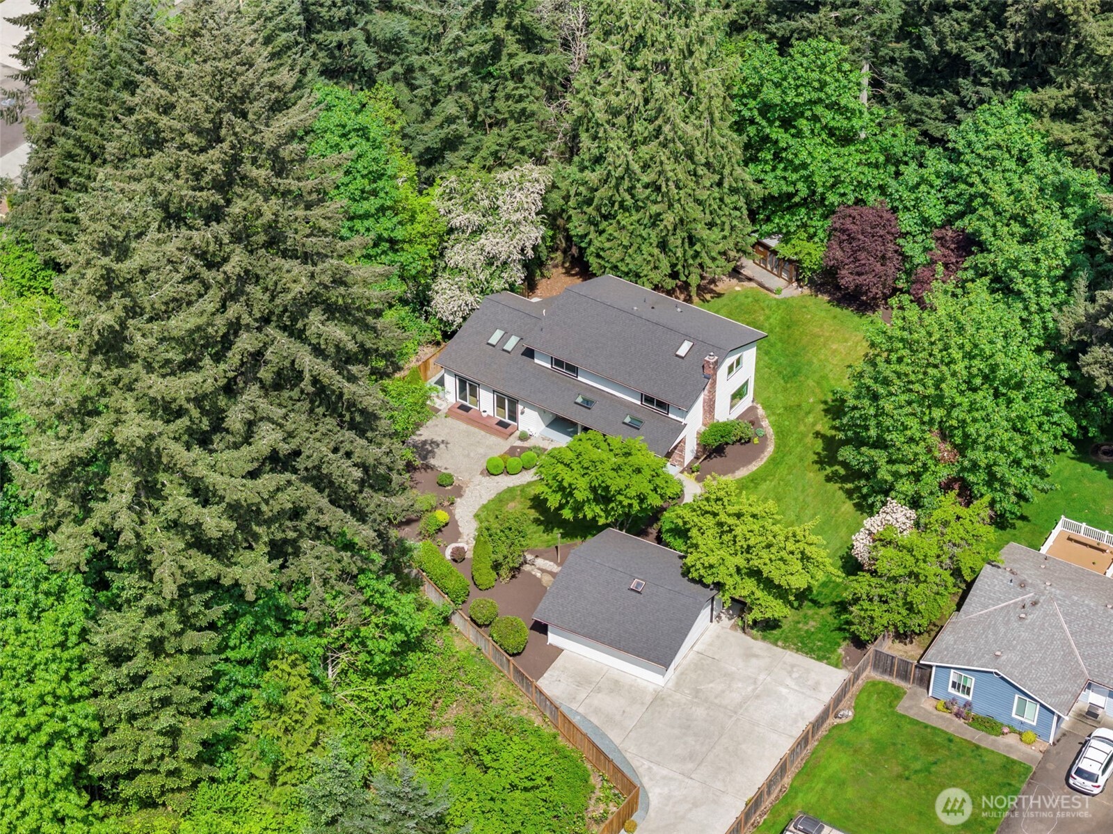 121 West Winesap Road Bothell, WA 98012 - Photo 28 of 29 an aerial view of a house with yard and outdoor seating
