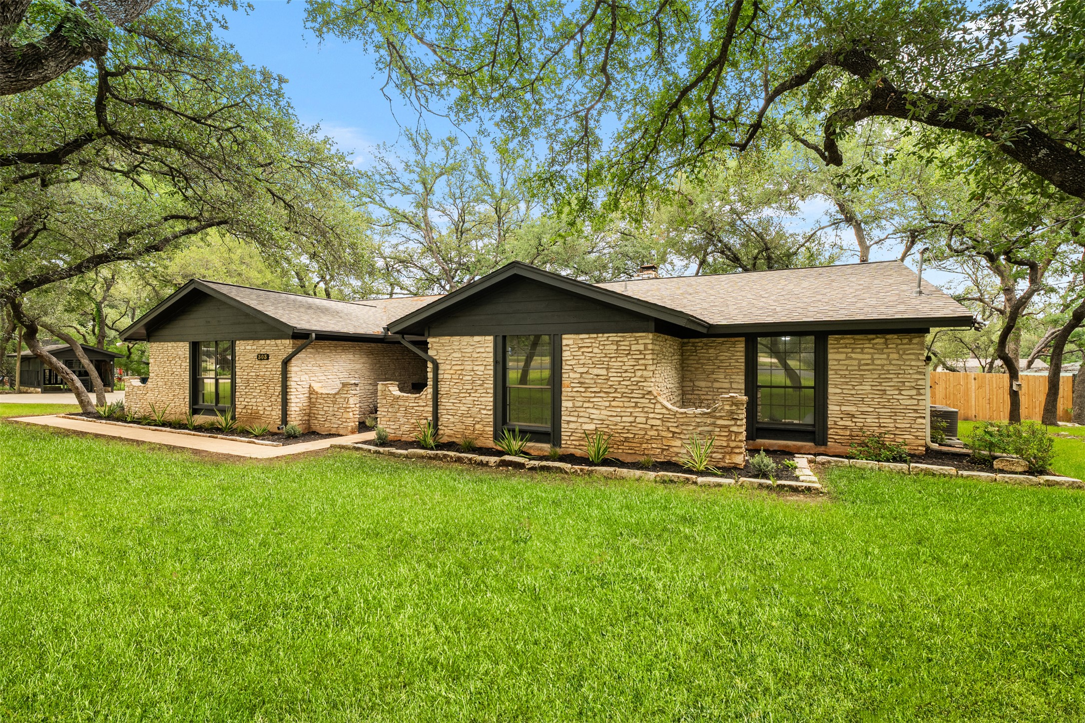 303 West Sequoia Spur Georgetown, TX 78628 - Photo 31 of 34 a front view of a house with a yard and pathway