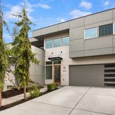 a front view of a house with garage