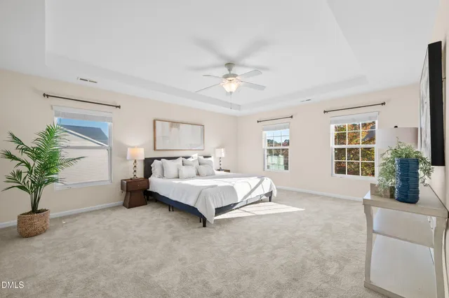 a spacious bedroom with a large bed and a couch