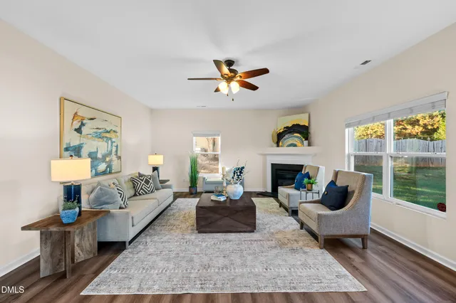 a living room with furniture and a fireplace