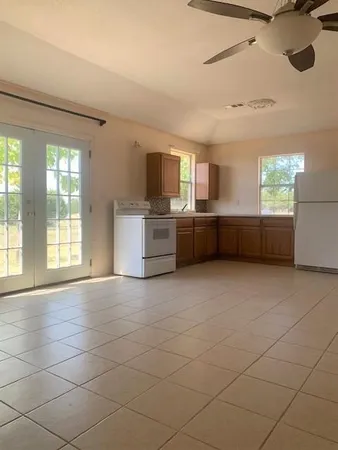 a view of kitchen and windows