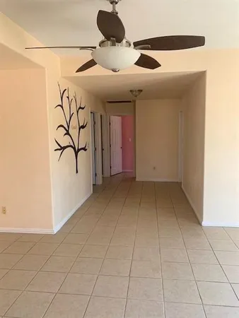 a view of an empty room with a window