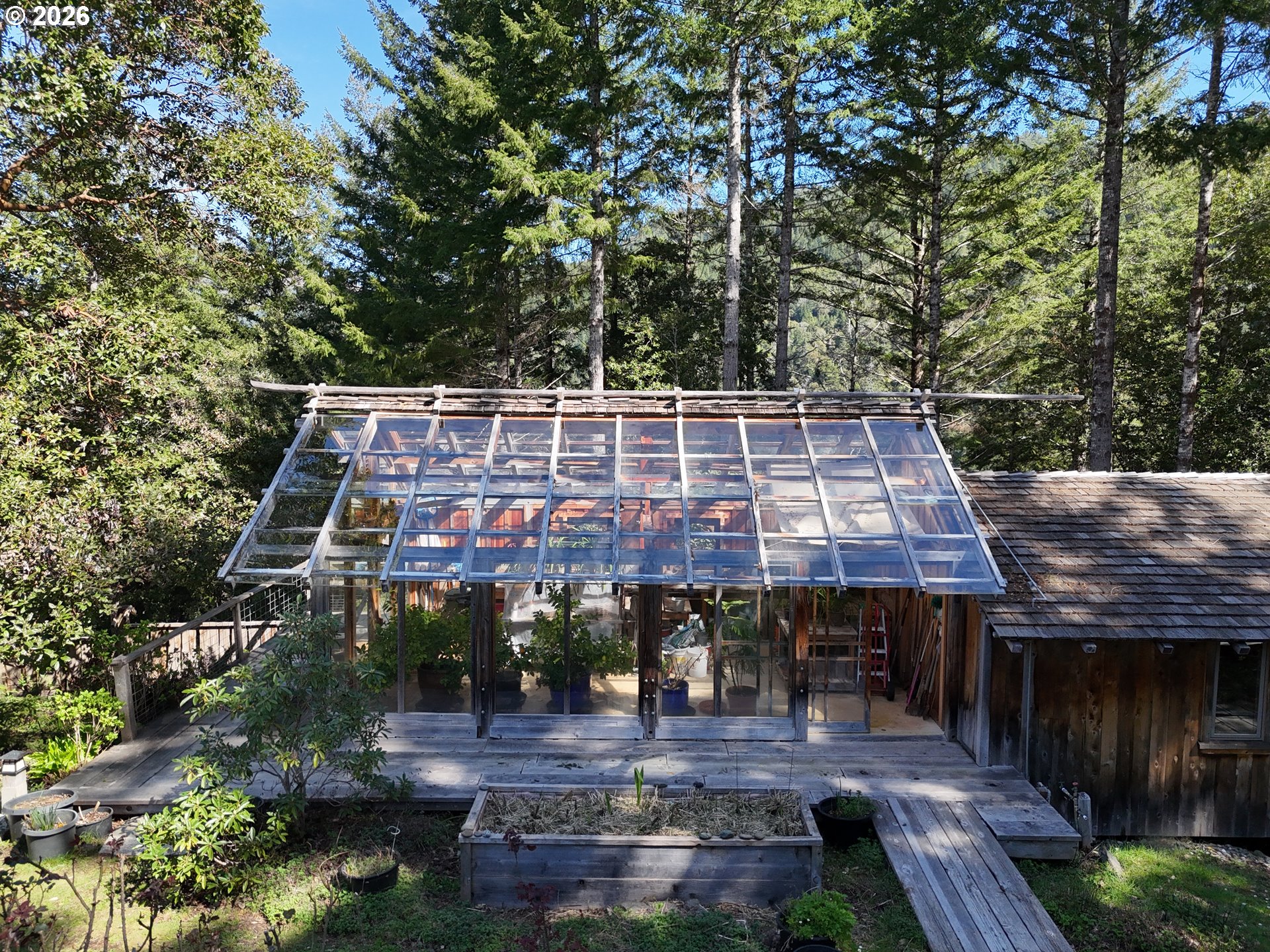 a aerial view of a house with swimming pool and garden