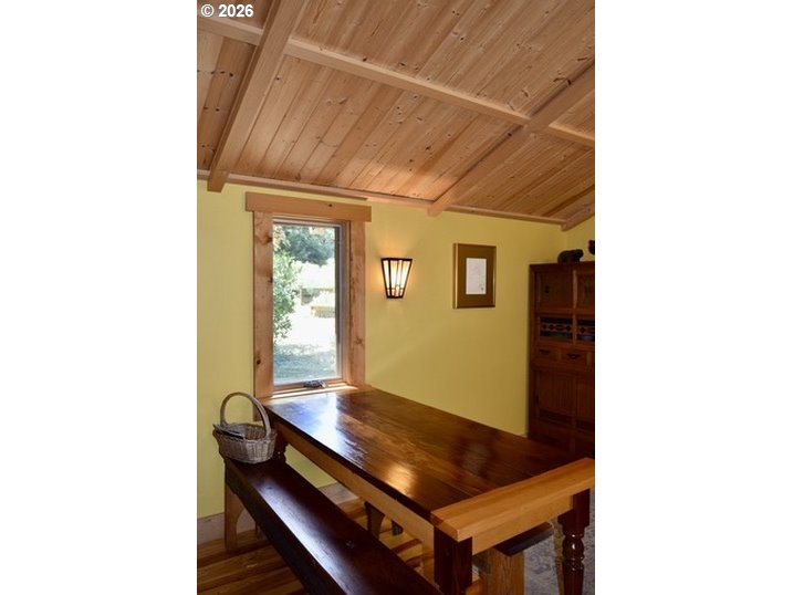 97137 North Bank Rogue River Road Gold Beach, OR 97444 - Photo 12 of 40 a room with furniture and window