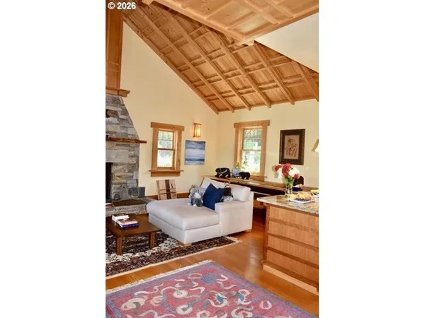 a living room with furniture and a rug