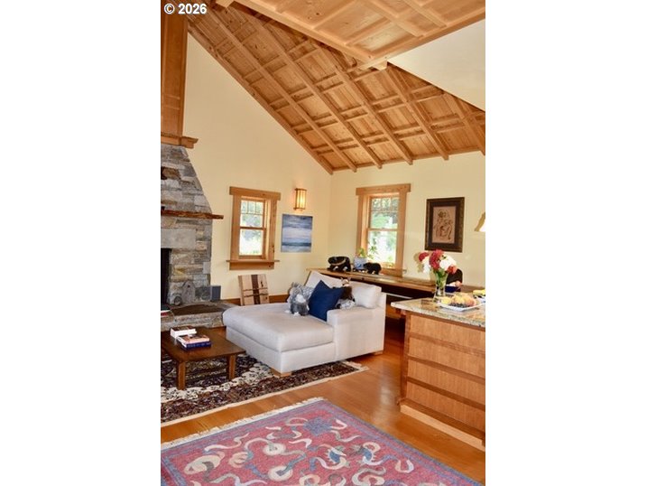 97137 North Bank Rogue River Road Gold Beach, OR 97444 - Photo 17 of 40 a living room with furniture and a rug