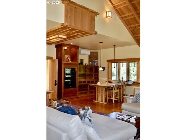 a view of a patio with a table and chairs under an umbrella