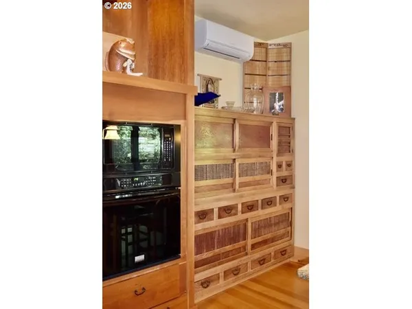 a picture of a bathroom with a walk in closet and balcony