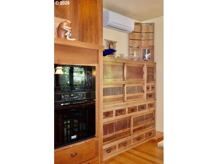 97137 North Bank Rogue River Road Gold Beach, OR 97444 - Photo 31 of 40 a picture of a bathroom with a walk in closet and balcony