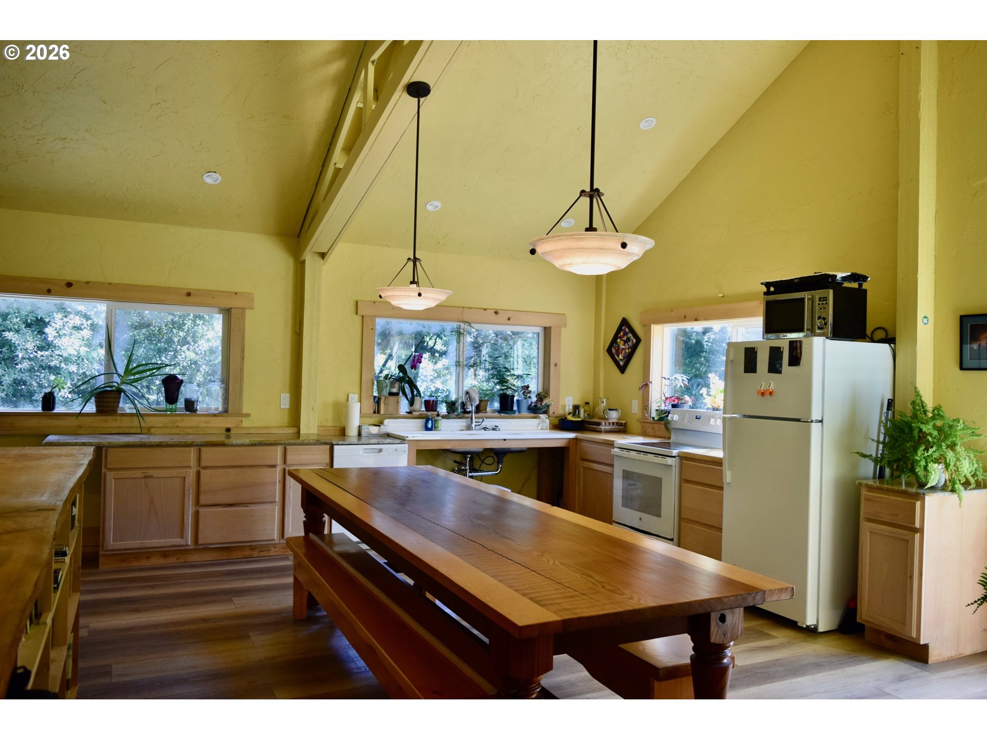 97137 North Bank Rogue River Road Gold Beach, OR 97444 - Photo 41 of 44 a kitchen with sink and refrigerator