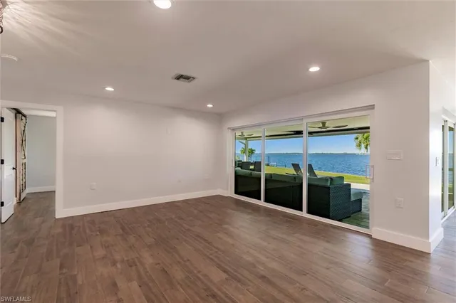 a room with furniture and a large window