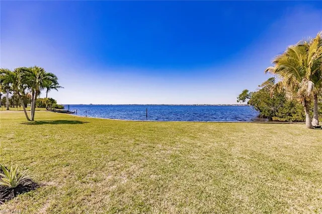 a front view of a house with swimming pool and porch