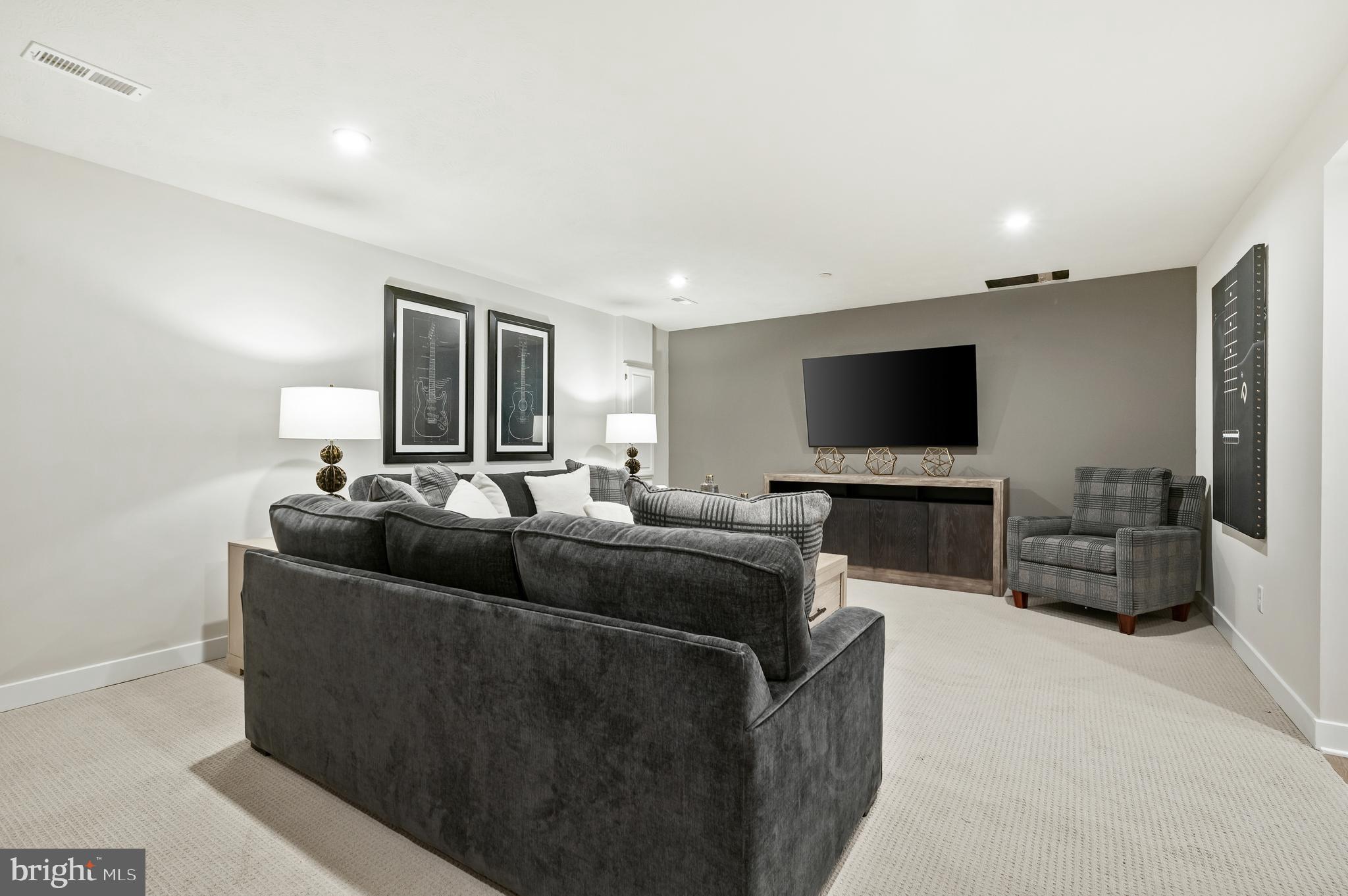 8548 Branch Side Way, Unit B Brandywine, MD 20613 - Photo 19 of 21 a living room with furniture and a flat screen tv