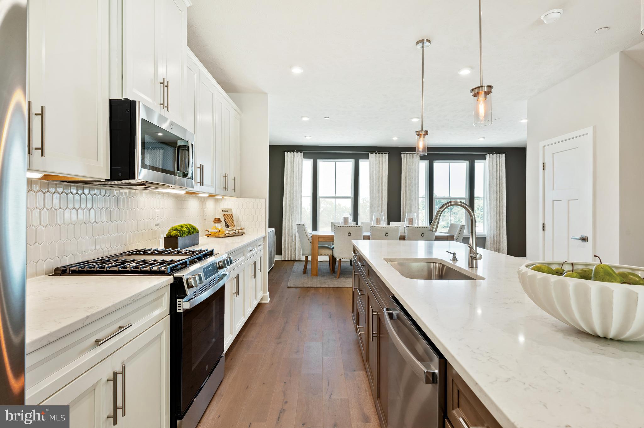 8548 Branch Side Way, Unit B Brandywine, MD 20613 - Photo 2 of 21 a kitchen with stainless steel appliances granite countertop a sink a stove and a wooden floors