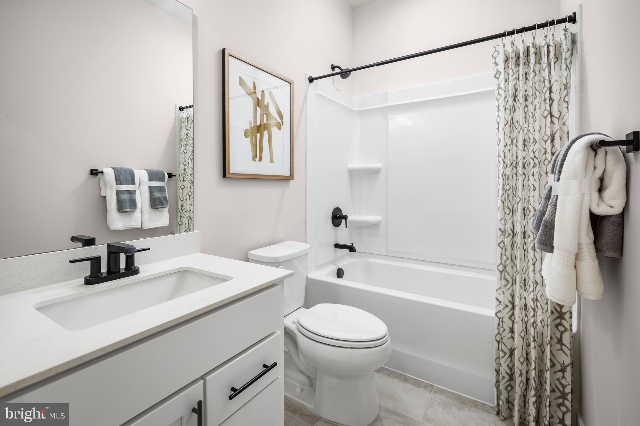 8548 Branch Side Way, Unit B Brandywine, MD 20613 - Photo 21 of 21 a bathroom with a sink a toilet and a bathtub