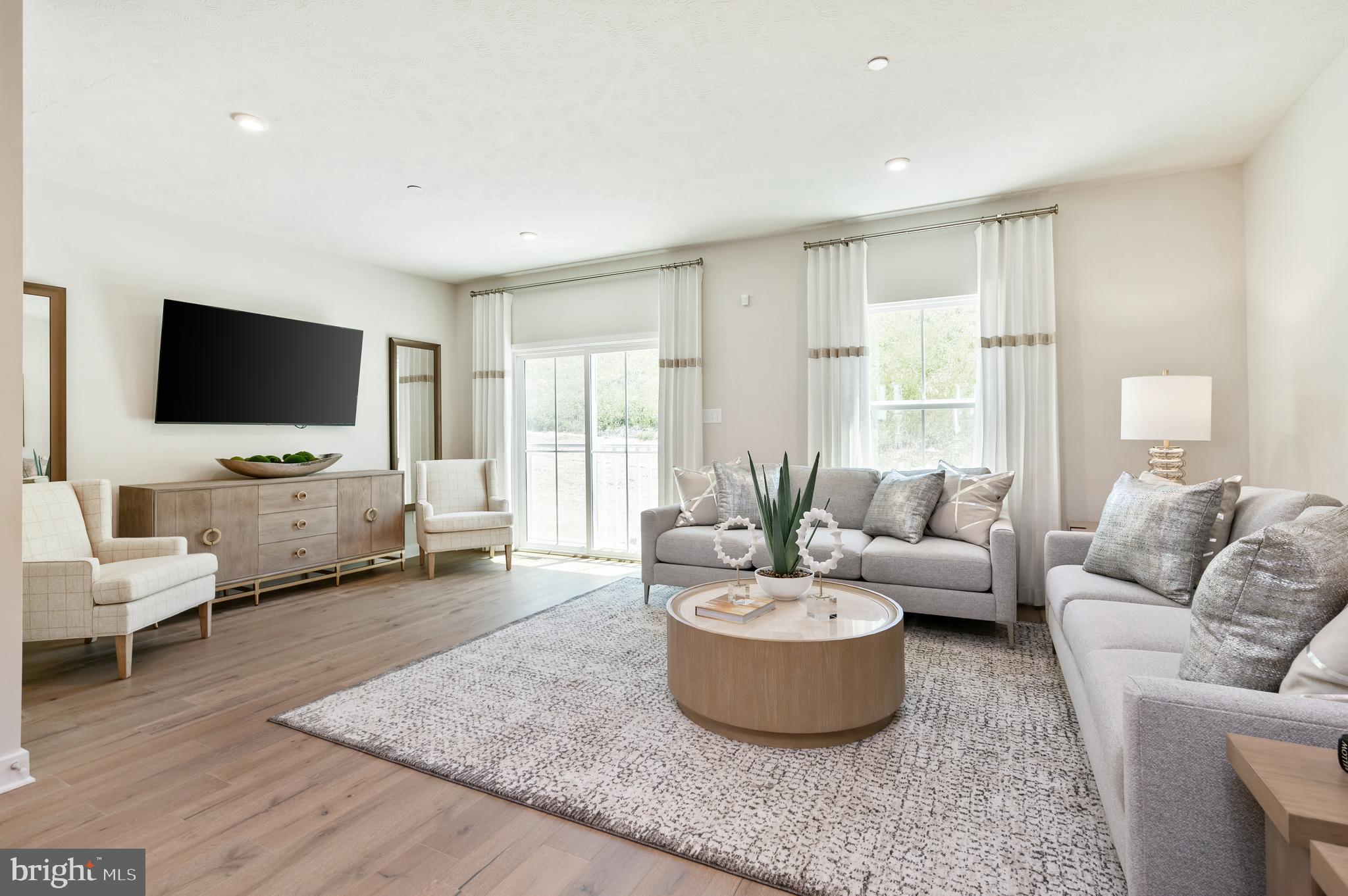 8548 Branch Side Way, Unit B Brandywine, MD 20613 - Photo 6 of 21 a living room with furniture and a flat screen tv