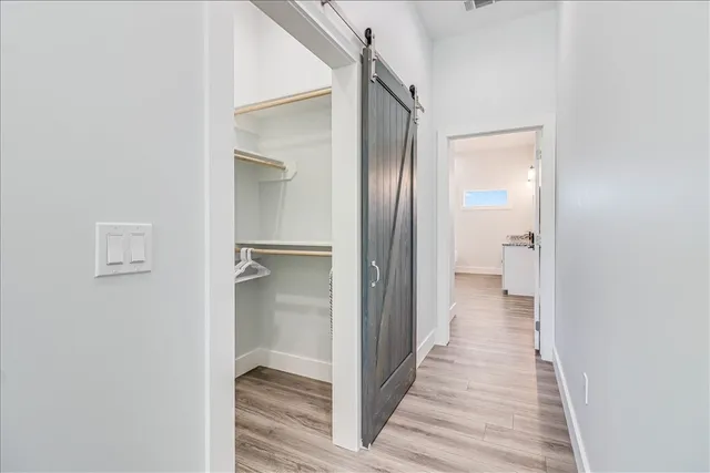 a view of a bathroom from a hallway