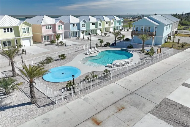 a view of swimming pool with outdoor seating