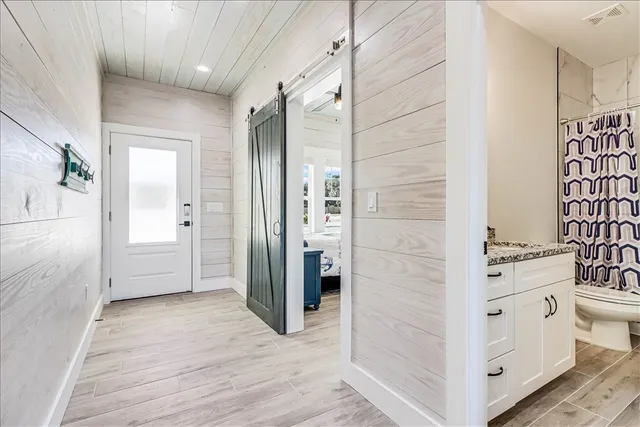 a bathroom with a double vanity sink and mirror