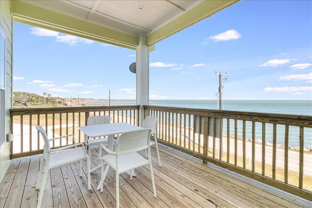 a view of a balcony with furniture