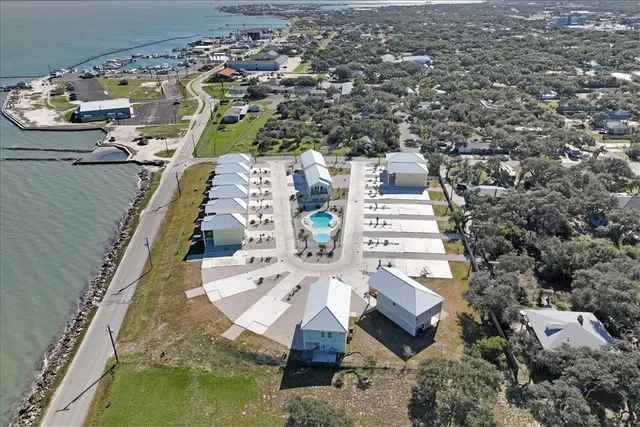an aerial view of a house with outdoor space