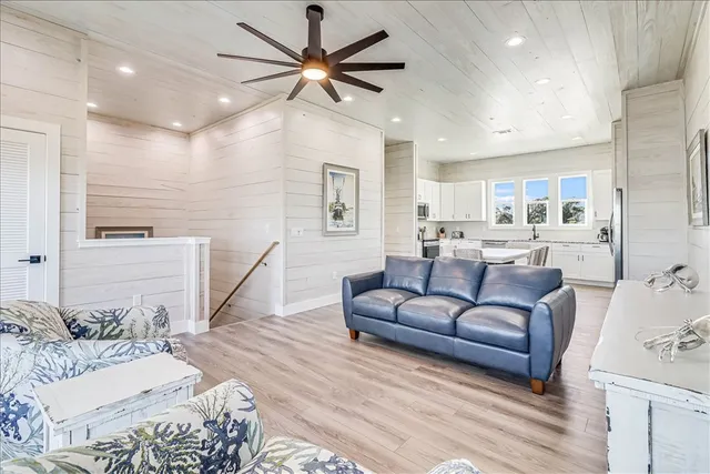 a large bedroom with a large bed couch and a window