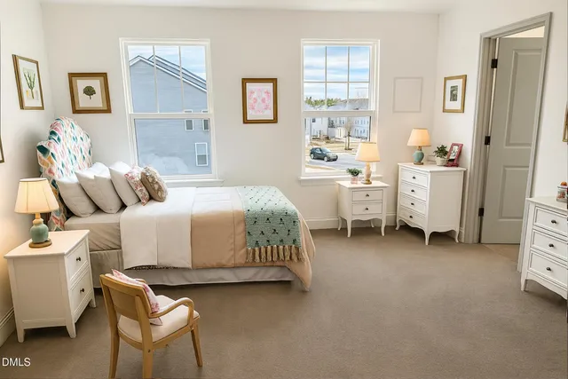 a bedroom with a bed and a chair