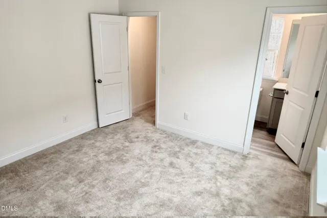 a bedroom with furniture and a wooden floor