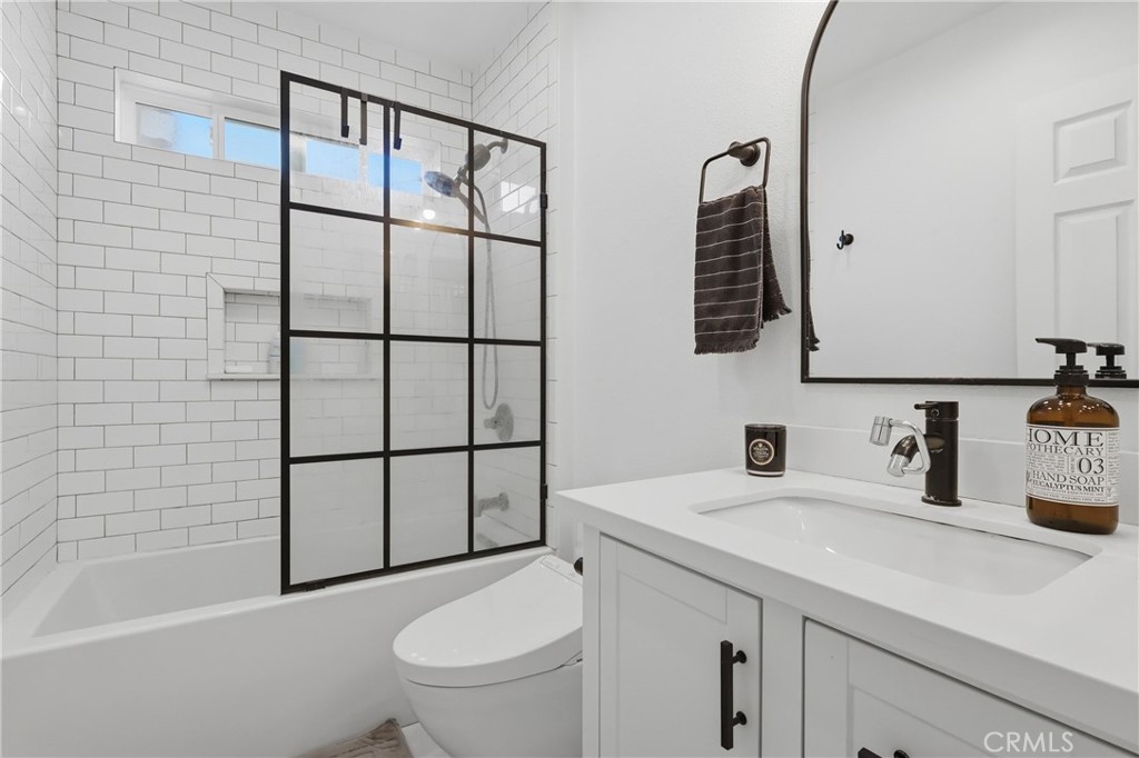 1540 East Wardlow Road Long Beach, CA 90807 - Photo 11 of 38 a bathroom with a sink toilet and shower