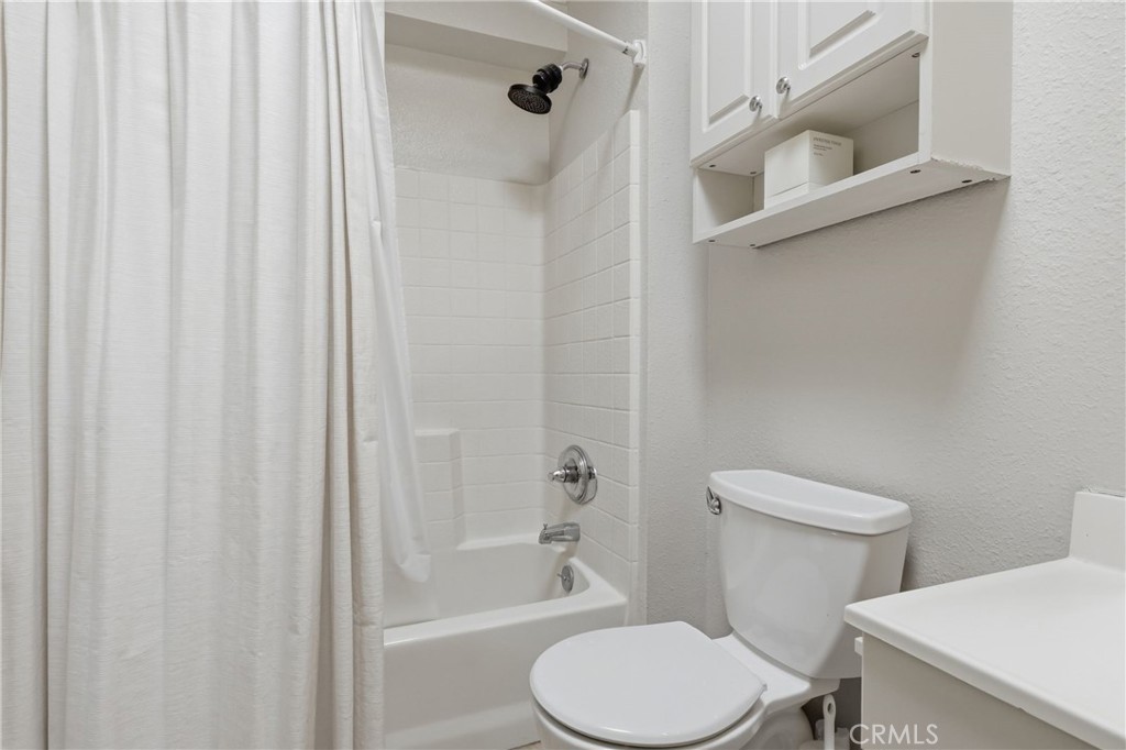1540 East Wardlow Road Long Beach, CA 90807 - Photo 15 of 38 a white toilet sitting next to a bath tub