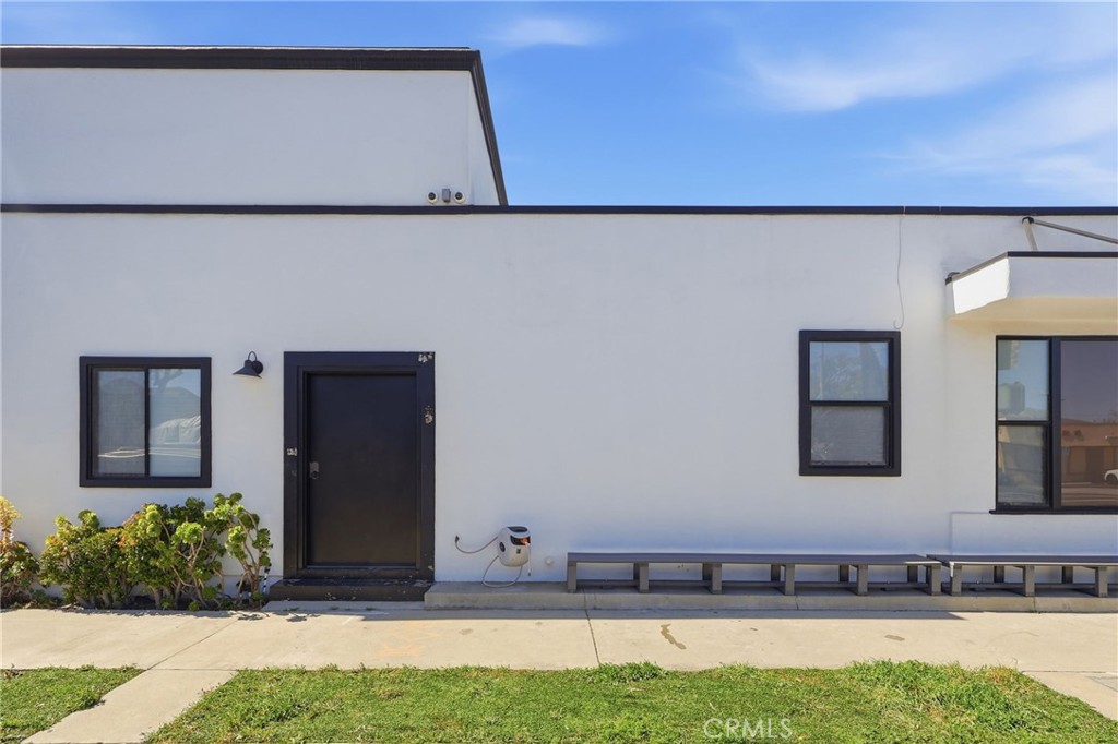 1540 East Wardlow Road Long Beach, CA 90807 - Photo 25 of 38 a view of a house with a yard