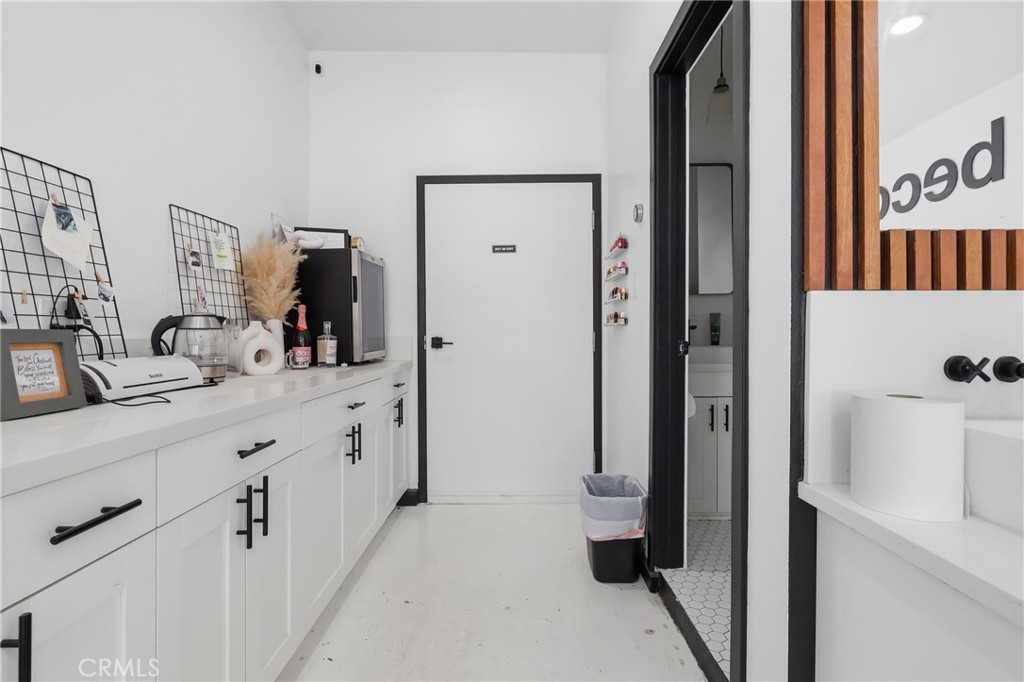 1540 East Wardlow Road Long Beach, CA 90807 - Photo 28 of 38 a spacious bathroom with a double vanity sink a mirror and shower