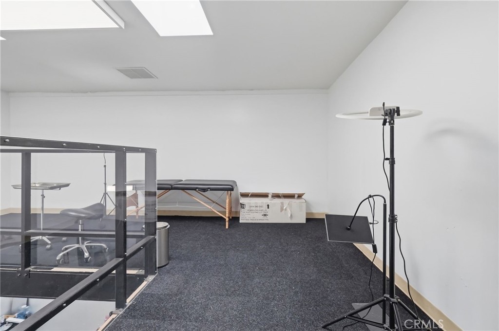 1540 East Wardlow Road Long Beach, CA 90807 - Photo 32 of 38 a view of workspace with couch