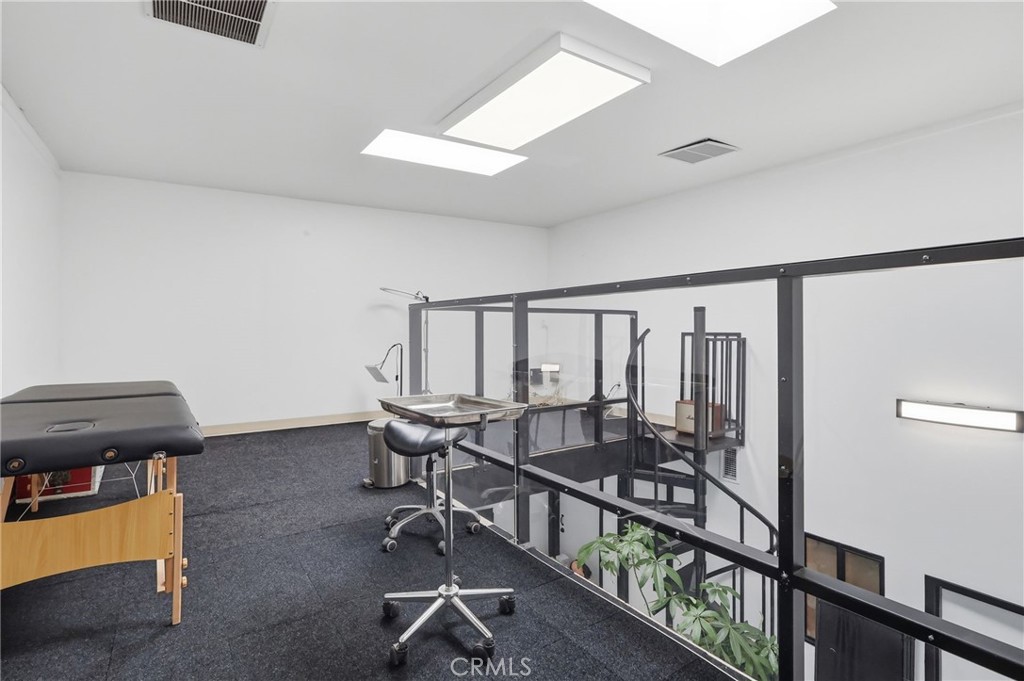1540 East Wardlow Road Long Beach, CA 90807 - Photo 34 of 38 a view of a hallway with workspace and wooden floor