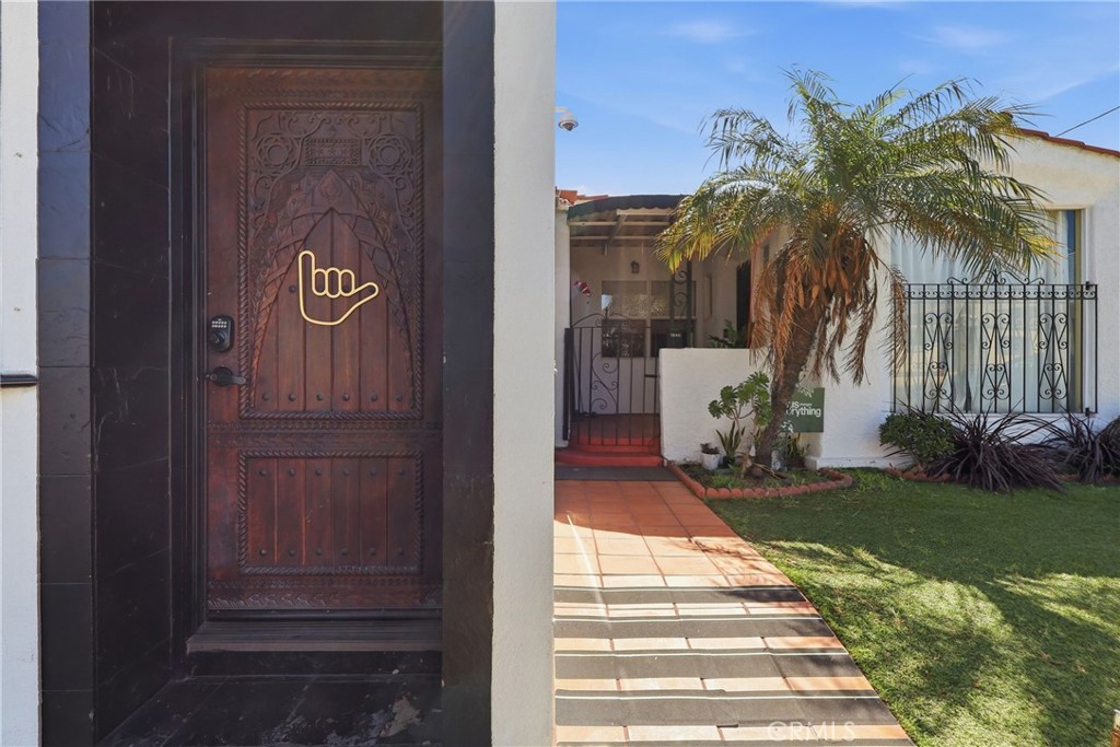 1540 East Wardlow Road Long Beach, CA 90807 - Photo 4 of 38 a sign board with yard