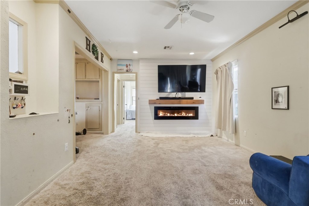 1540 East Wardlow Road Long Beach, CA 90807 - Photo 5 of 38 a living room with furniture and a flat screen tv