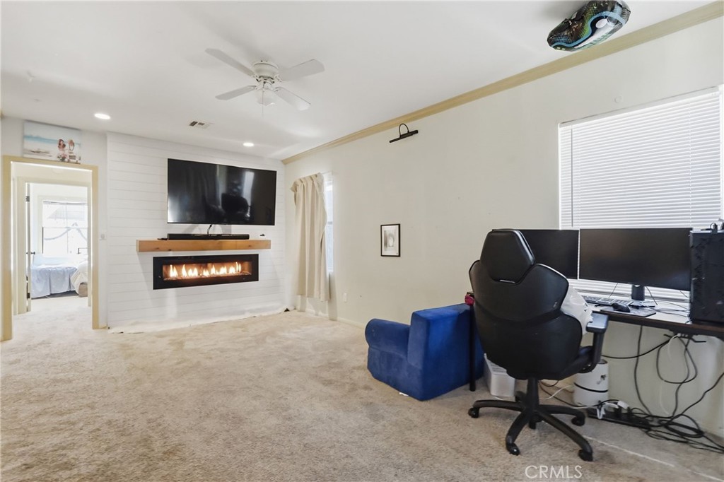 1540 East Wardlow Road Long Beach, CA 90807 - Photo 6 of 38 a view of a livingroom with workspace and a window