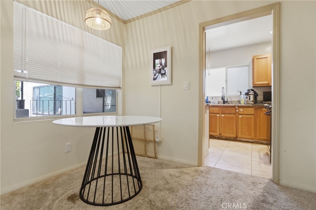 1540 East Wardlow Road Long Beach, CA 90807 - Photo 8 of 38 wooden floor with a white cabinets and a view of kitchen