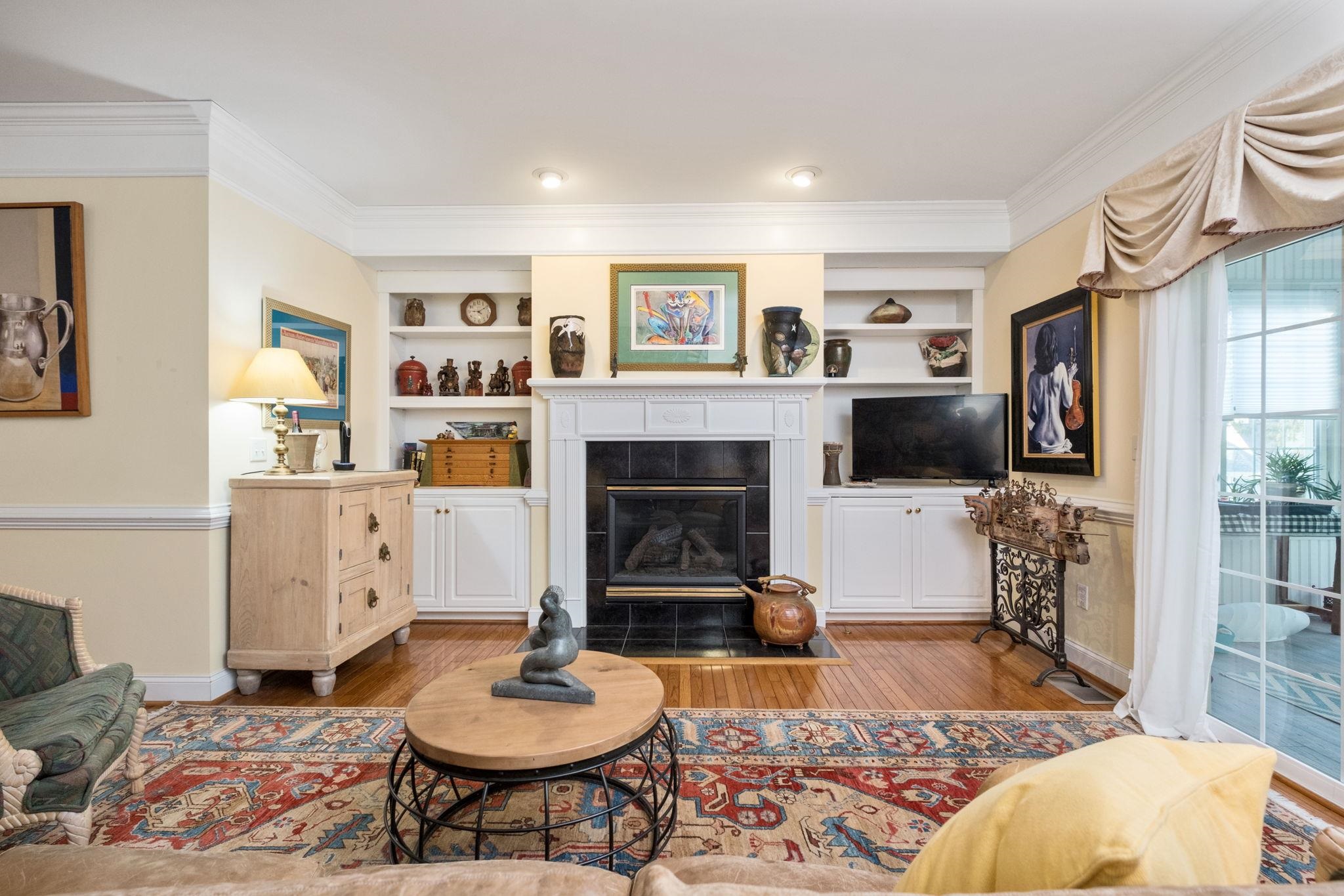 35 Buckingham Common Waynesboro, VA 22980 - Photo 12 of 33 a living room with furniture a flat screen tv and a fireplace