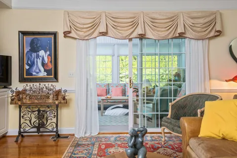 a bedroom with furniture and a window