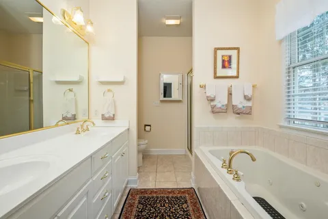 a bathroom with a sink a bathtub and a shower
